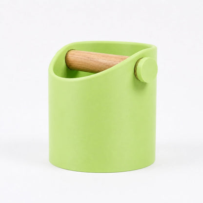 KNOCDIC® minimalist coffee knock box with a green body and real oak wood bar for espresso puck disposal.