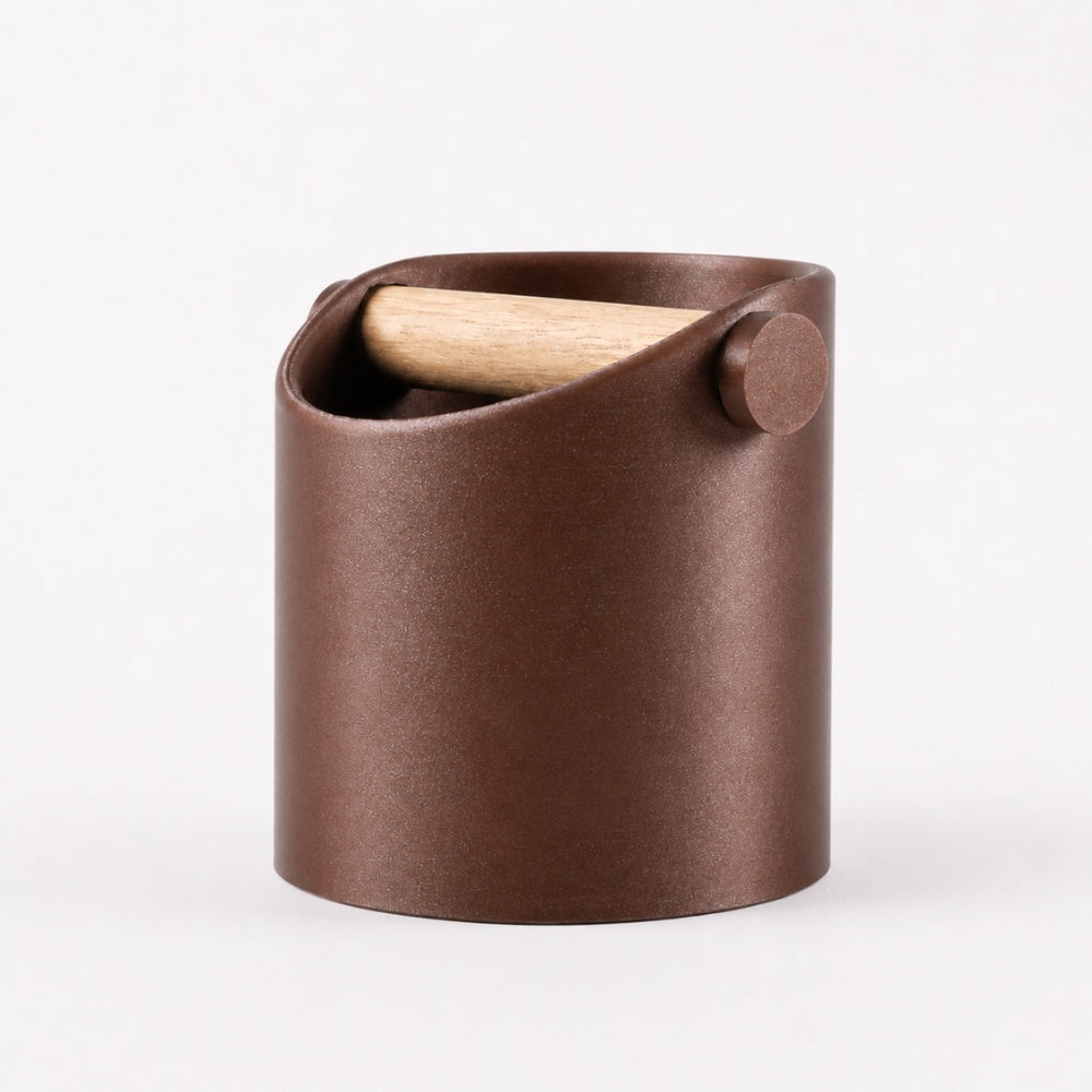Minimalist coffee knock box with galaxy brown finish and real oak wood bar, designed by KNOCDIC® for espresso machine use