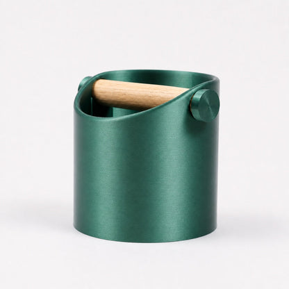 KNOCDIC® minimalist coffee knock box with metallic green finish and real oak wood bar for espresso grounds disposal.