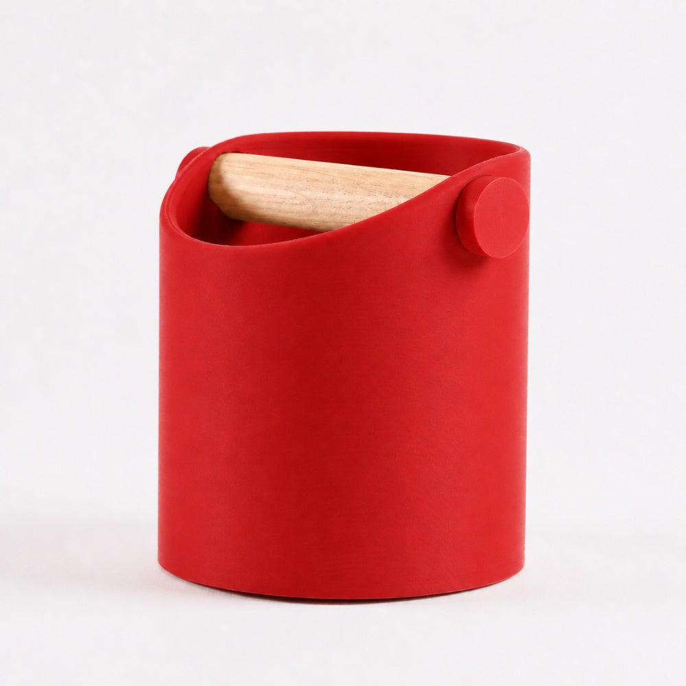 Red minimalist coffee knock box with real oak wood bar by KNOCDIC® for easy espresso puck disposal.