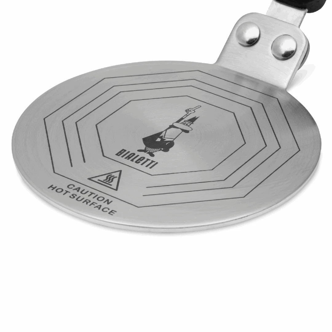 Bialetti induction plate converter for moka express, compatible with Bialetti hardware, by Brew Italia, shown on a stovetop.