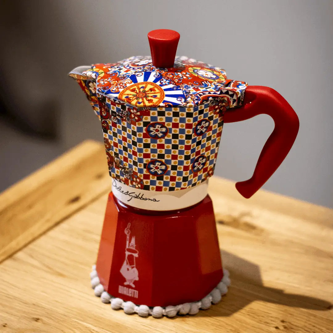 Bialetti X Dolce&Gabbana Sicilian Cart Moka Express coffee maker with branded brass hardware and traditional Italian design
