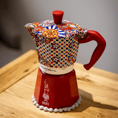 Bialetti X Dolce&Gabbana Sicilian Cart Moka Express coffee maker with branded brass hardware and traditional Italian design