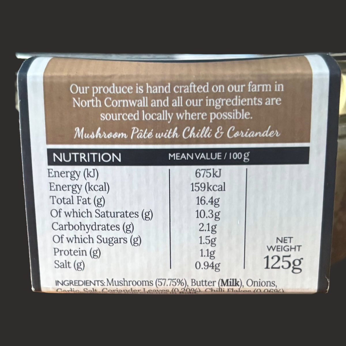 Creamy Cornish Mushroom Pâté with chili and coriander from ArtisanBox Selection, shown in a jar with mushrooms and herbs.