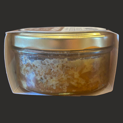 Creamy Cornish Mushroom Pâté with chili and coriander from ArtisanBox Selection, shown spread on bread with fresh herbs.
