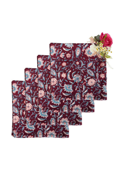Set of four maroon table napkins by Casa by Josephine Jenno, soft fabric, neatly folded for elegant table settings.