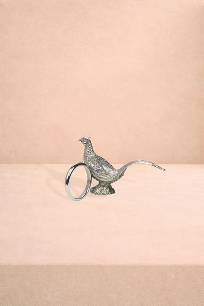 Set of four Casa by Josephine Jenno pheasant feathered pewter napkin rings showcasing detailed feather designs.