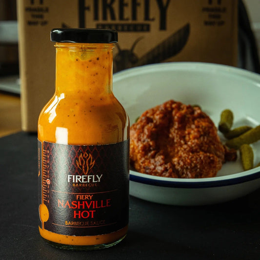 FireFly Barbecue Nashville Hot Sauce bottle, showcasing vibrant label and spicy BBQ sauce for grilling and dipping.
