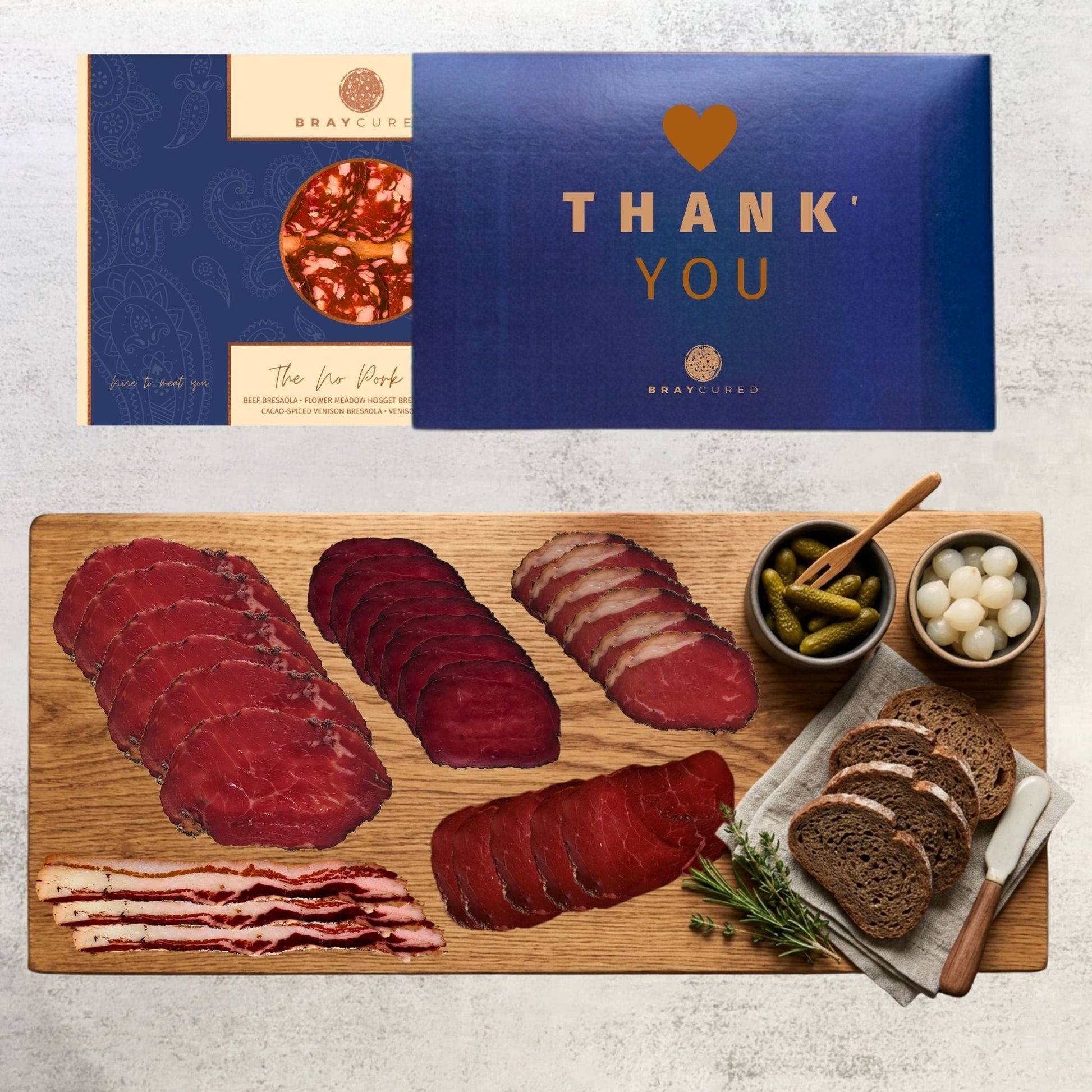 Assorted no-pork charcuterie board from Bray Cured featuring a variety of cured meats and accompaniments on a wooden serving board.