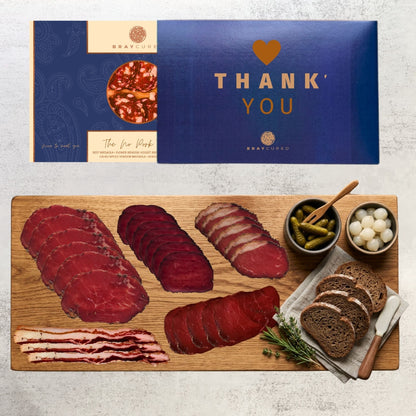 Assorted no-pork charcuterie board from Bray Cured featuring a variety of cured meats and accompaniments on a wooden serving board.