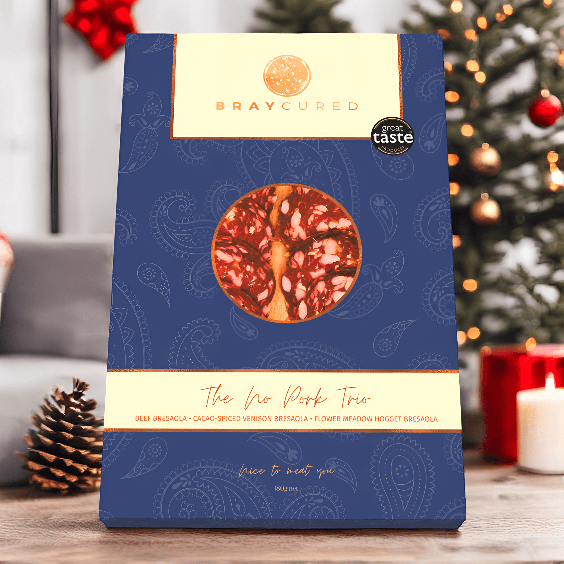 Bray Cured No Pork Tasting Trio featuring assorted pork-free charcuterie slices arranged on a holiday-themed background.