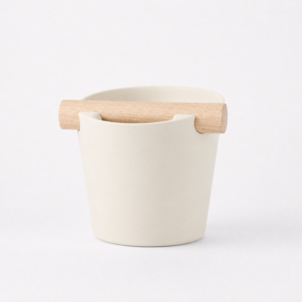 Nordic Coffee Knock Box by KNOCDIC® with natural oak wood bar and ivory white ceramic container for espresso grounds.