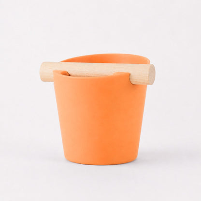 KNOCDIC® Nordic Coffee Knock Box with orange exterior and real oak wood bar for espresso puck disposal.