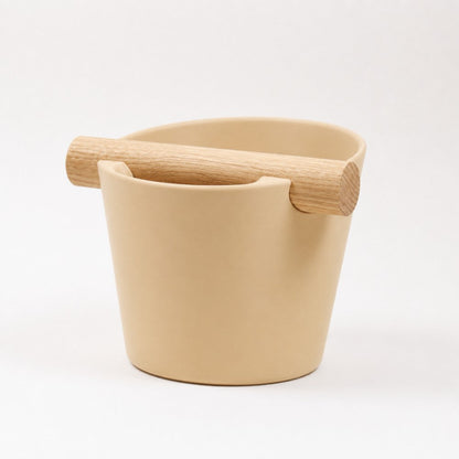 KNOCDIC Nordic Coffee Knock Box with real oak wood bar in desert tan, used for espresso puck disposal and coffee preparation.