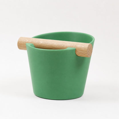 Nordic Coffee Knock Box by KNOCDIC® with a real oak wood bar, in grass green, for espresso shot disposal.
