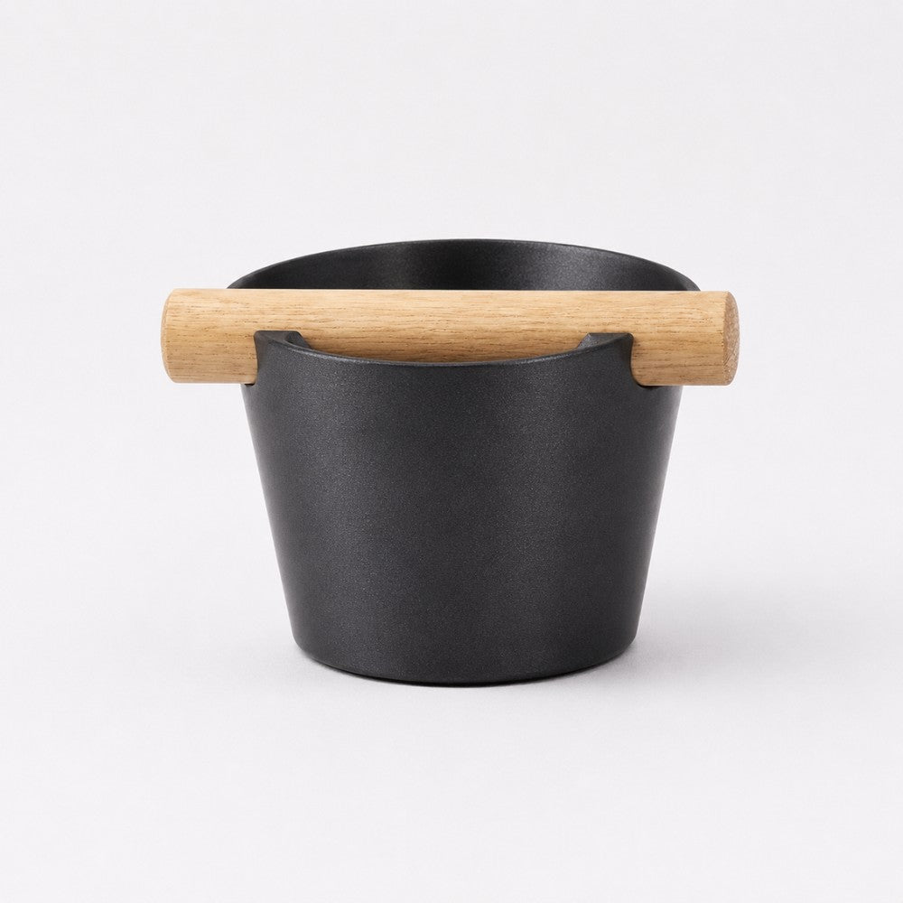 Nordic Coffee Knock Box by KNOCDIC® with metallic black finish and real oak wood bar for espresso puck disposal.