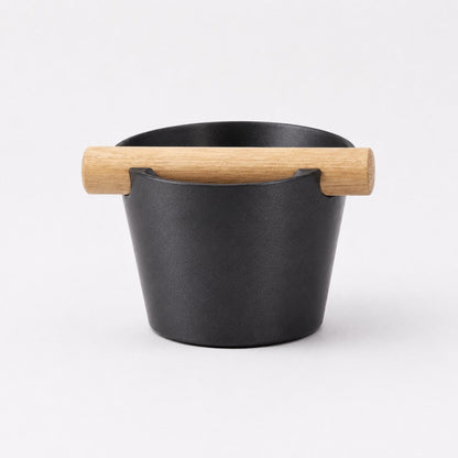 Nordic Coffee Knock Box by KNOCDIC® with metallic black finish and real oak wood bar for espresso puck disposal.