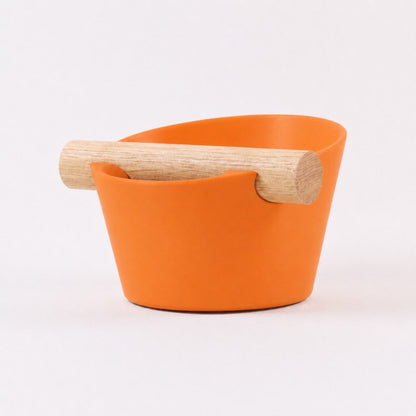 KNOCDIC® Nordic Coffee Knock Box with orange exterior and real oak wood bar for espresso portafilter knock box.