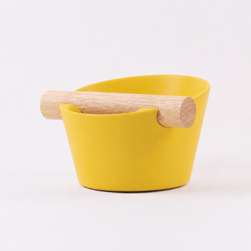 KNOCDIC® Nordic Coffee Knock Box with real oak wood bar, yellow color, used for knocking out espresso grounds in barista coffee making.