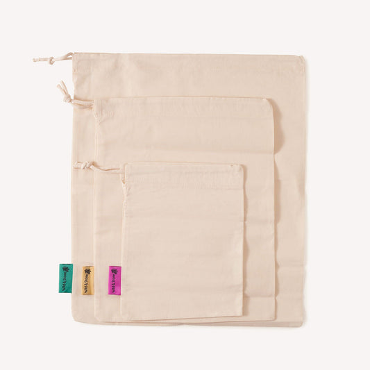 Set of three reusable organic cotton produce bags by Wild And Stone for shopping fruits and vegetables.