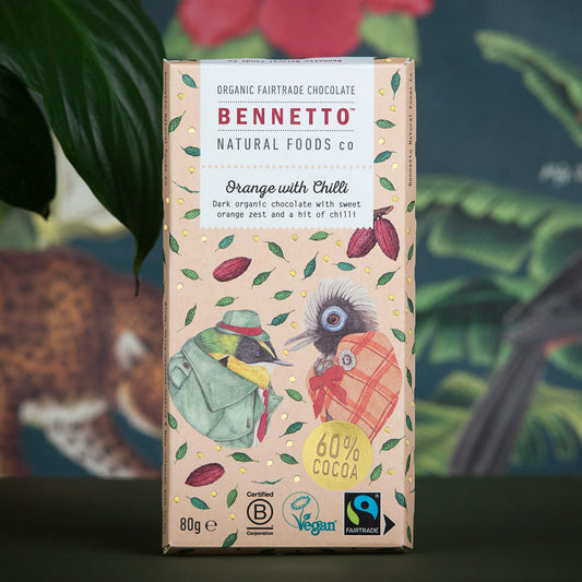 Bennetto Natural Foods UK orange with chili flavored chocolate bar, showing the vibrant orange and chili pieces inside.
