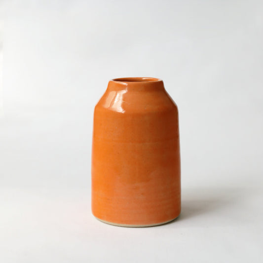 Orange mandarin orange bud vase by Katie L Thompson Designs, classic ceramic with a sleek white background.