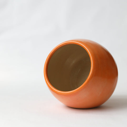 Katie L Thompson Designs Mandarin Orange Salt Pig on white background, ceramic kitchen storage for salt or spices.
