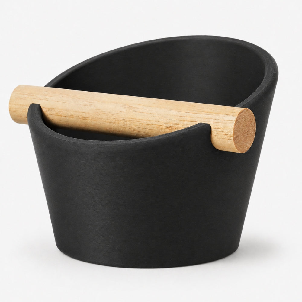 KNOCDIC® oval coffee knock box in charcoal with a real oak wood bar for espresso puck disposal.