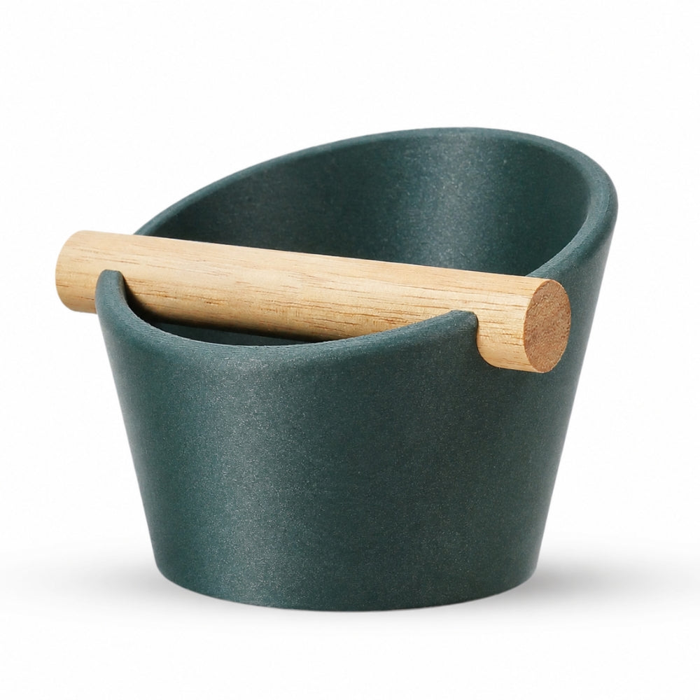 KNOCDIC® oval coffee knock box with galaxy green finish and real oak wood bar for espresso machine portafilter taming.