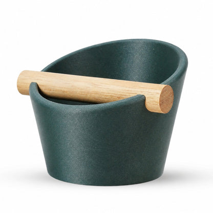 KNOCDIC® oval coffee knock box with galaxy green finish and real oak wood bar for espresso machine portafilter taming.