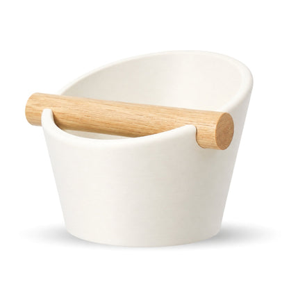 KNOCDIC® oval coffee knock box with ivory white finish and real oak wood bar for espresso machine cleanup.