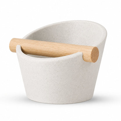 KNOCDIC® oval coffee knock box with marble white exterior and real oak wood bar for espresso shot disposal.