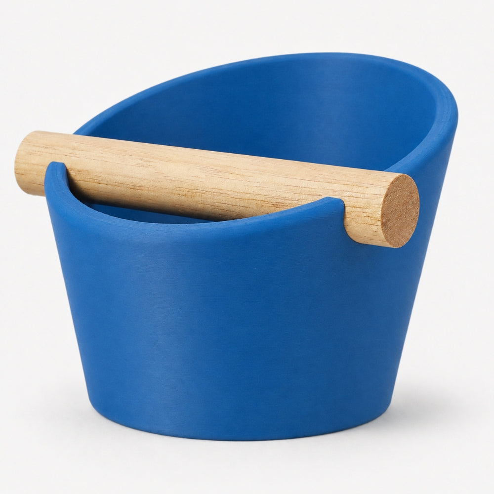 Oval coffee knock box by KNOCDIC® with marine blue finish and real oak wood bar for espresso machine use.