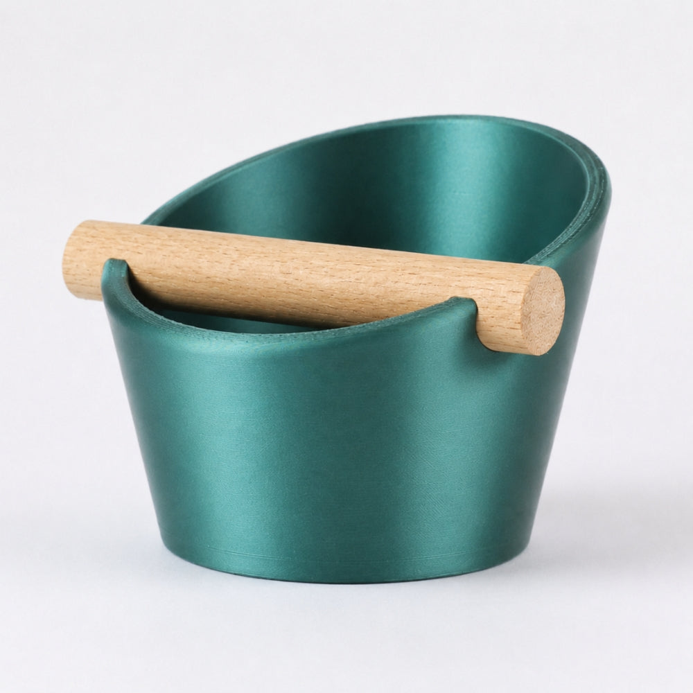 KNOCDIC® oval coffee knock box with metallic green finish and real oak wood bar for espresso puck disposal.