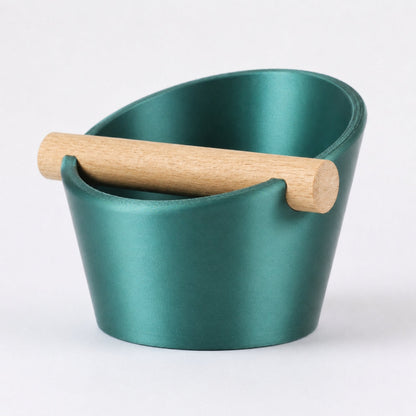 KNOCDIC® oval coffee knock box with metallic green finish and real oak wood bar for espresso puck disposal.