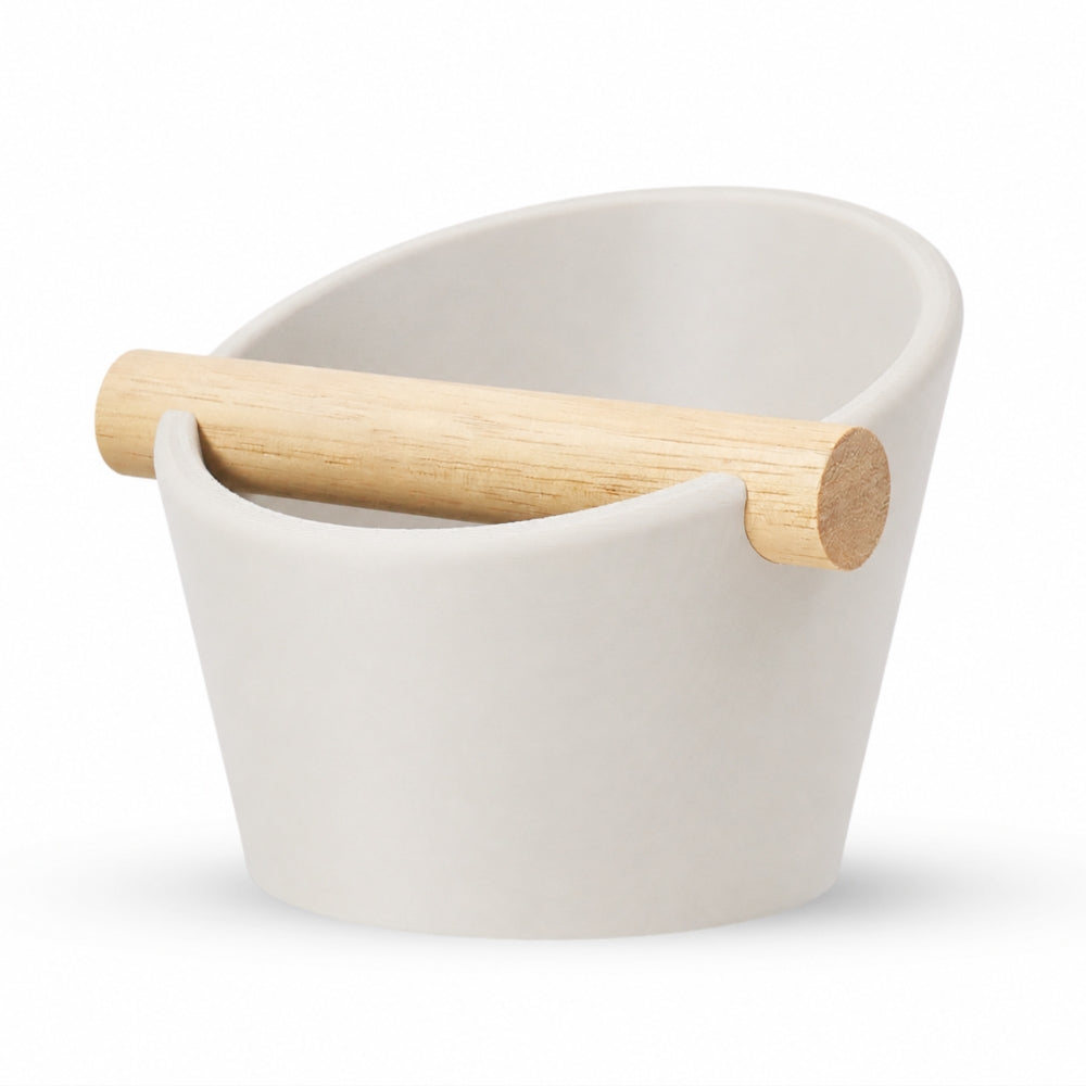 KNOCDIC® oval coffee knock box with off-white finish and real oak wood bar for espresso portafilter knocking.