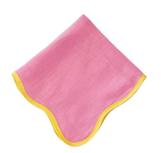 Pink and yellow scalloped napkin from domenicamarland with lace trim, folded beautifully for a decorative table setting.