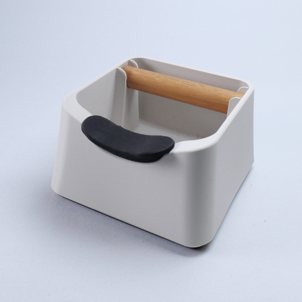 KNOCDIC® The Pod coffee knock box with black rubber exterior and metal bar for disposing used coffee grounds.