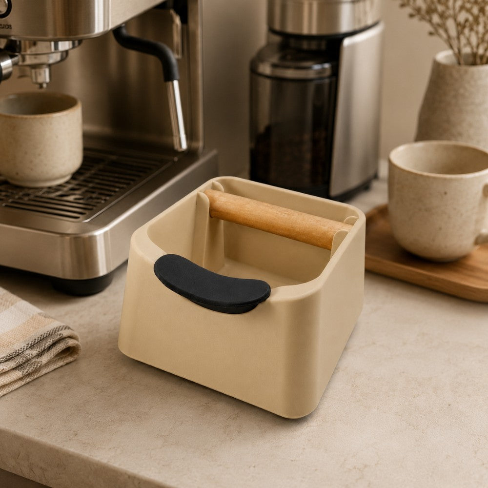 KNOCDIC® Pod Coffee Knock Box with stainless steel drum and wooden base, used for disposing of coffee grounds in a stylish kitchen setting.
