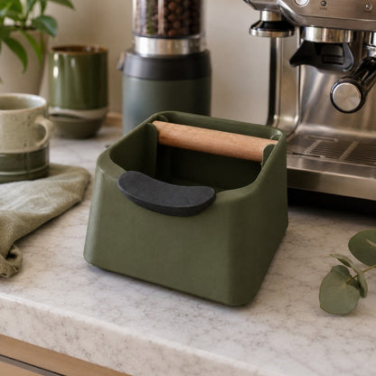 KNOCDIC® The Pod coffee knock box in a modern kitchen setting with a stainless steel exterior for espresso used coffee puck disposal.