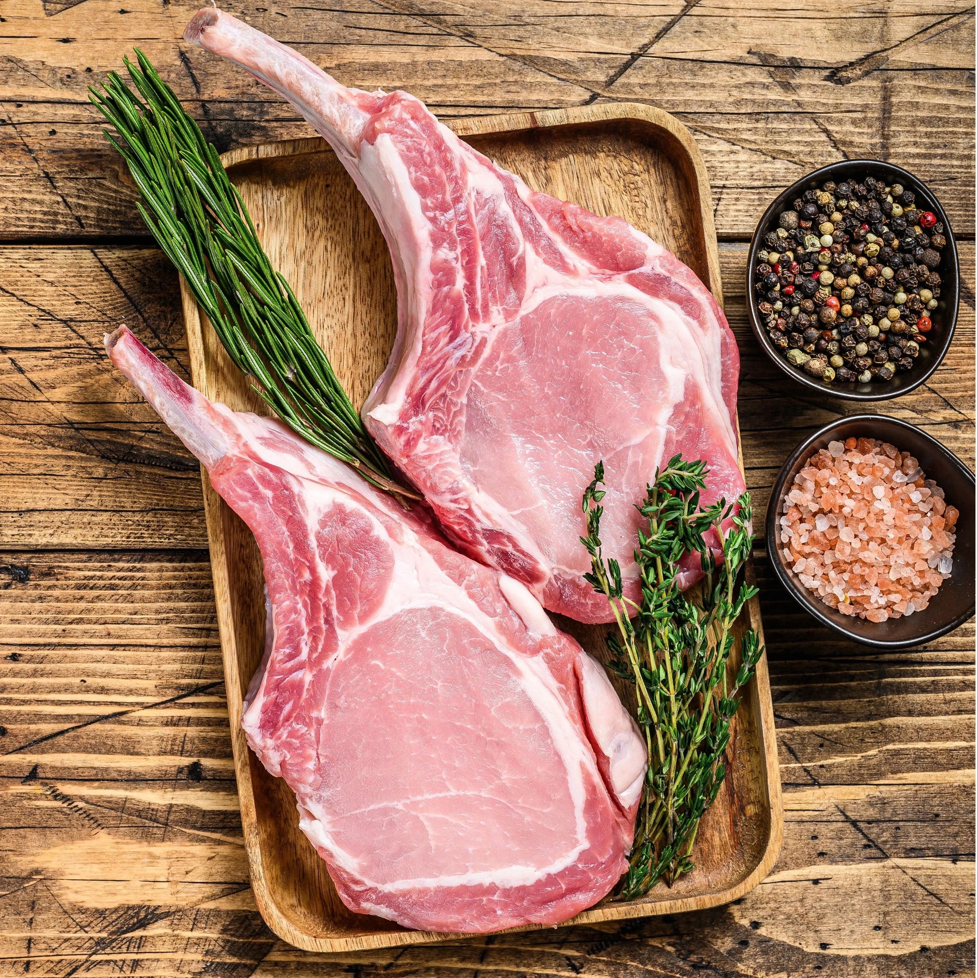 French-trimmed pork cutlets from Primrose Herd, showing tender pork chops with a clean, neatly trimmed edge ready for cooking.
