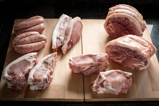 Family Pork Box from Primrose Herd featuring assorted fresh pork cuts in a branded meat box.