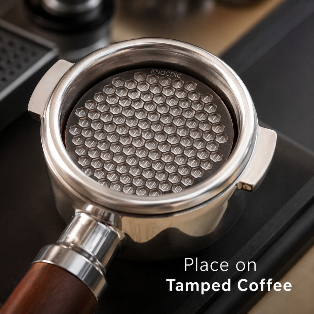 KNOCDIC® espresso puck screen in use inside a portafilter basket for even coffee extraction and clean brewing.