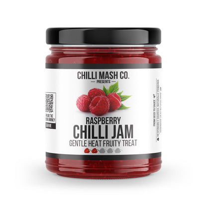 Jar of Raspberry Chilli Jam from Chilli Mash Co. with vibrant red jam and fresh raspberry and chilli pieces visible inside.