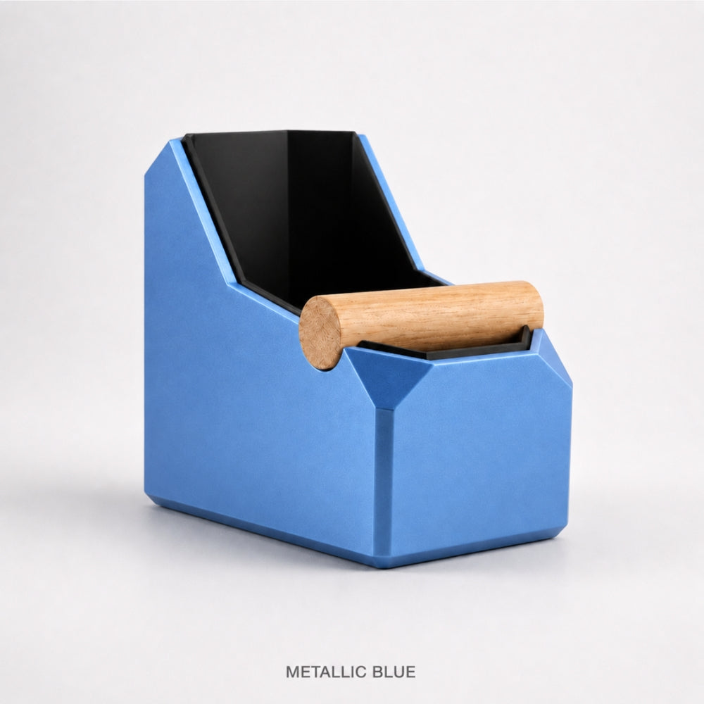 Rectangular metallic blue coffee knock box from KNOCDIC® with a real oak knock bar for espresso puck disposal.