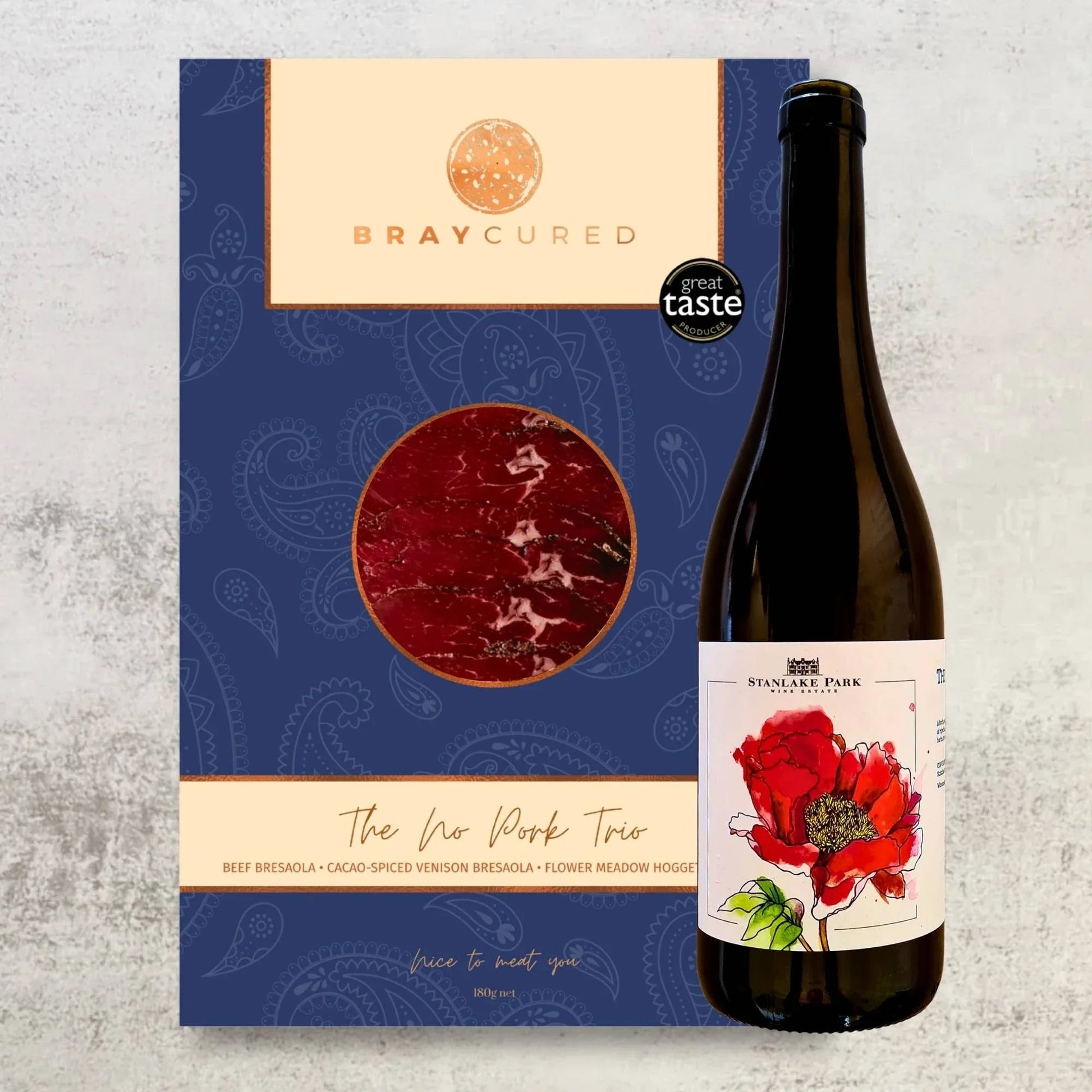 Assorted Bresaola slices from Bray Cured served with a glass of British Red Wine in a charcuterie hamper.