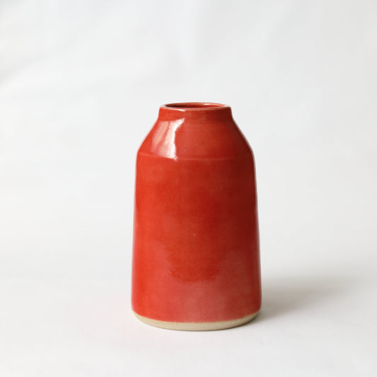 Cherry red classic bud vase by Katie L Thompson Designs, featuring a sleek, glossy red ceramic design on a white background.