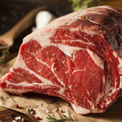 Prime Primrose Herd dry aged rib of beef joint, showing a beautifully roasted beef rib with a caramelized crust and bone.