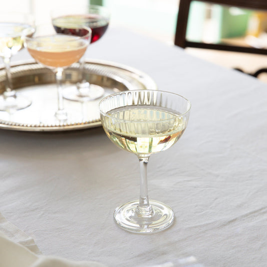 Crystal champagne saucers with a ripple design by The Vintage List, showcasing elegant glassware for celebratory moments.
