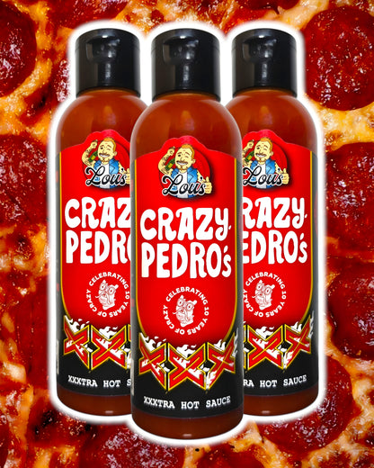 Bottle of Lou's Brews x Crazy Pedros XXX hot sauce with vibrant label, showcasing its spicy, flavorful condiment for dishes.